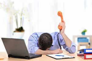 Frustrated Man with phone in the air listening to background music